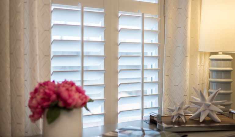 Plantation shutters by flowers in Fort Lauderdale